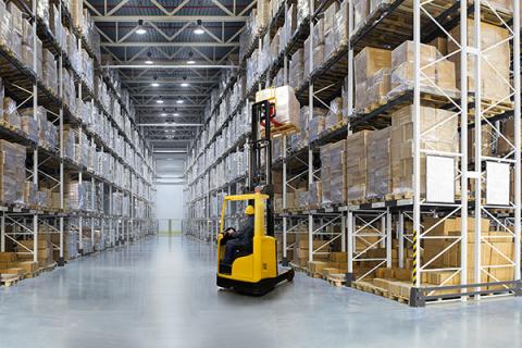 A frozen food warehouse with a forklift truck in the centre