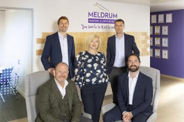 L-R: Dave Meldrum, OIiver William, Adrienne Paterson, Adrian Dyer and Matthew Walsh in front of the Meldrum Group sign.