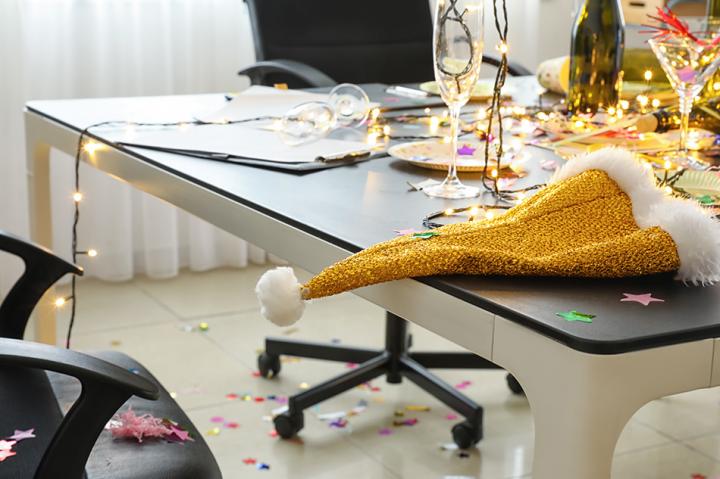 remnants of a Christmas party, office desk with party streamers