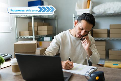 Businessman managing product inventory in his office