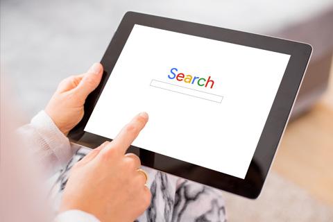 Someone using Google search on an ipad